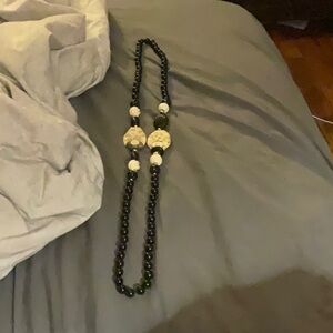 A long black and white necklace